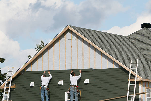 Professional Emergency Siding Repair technician working in Roosevelt, NY